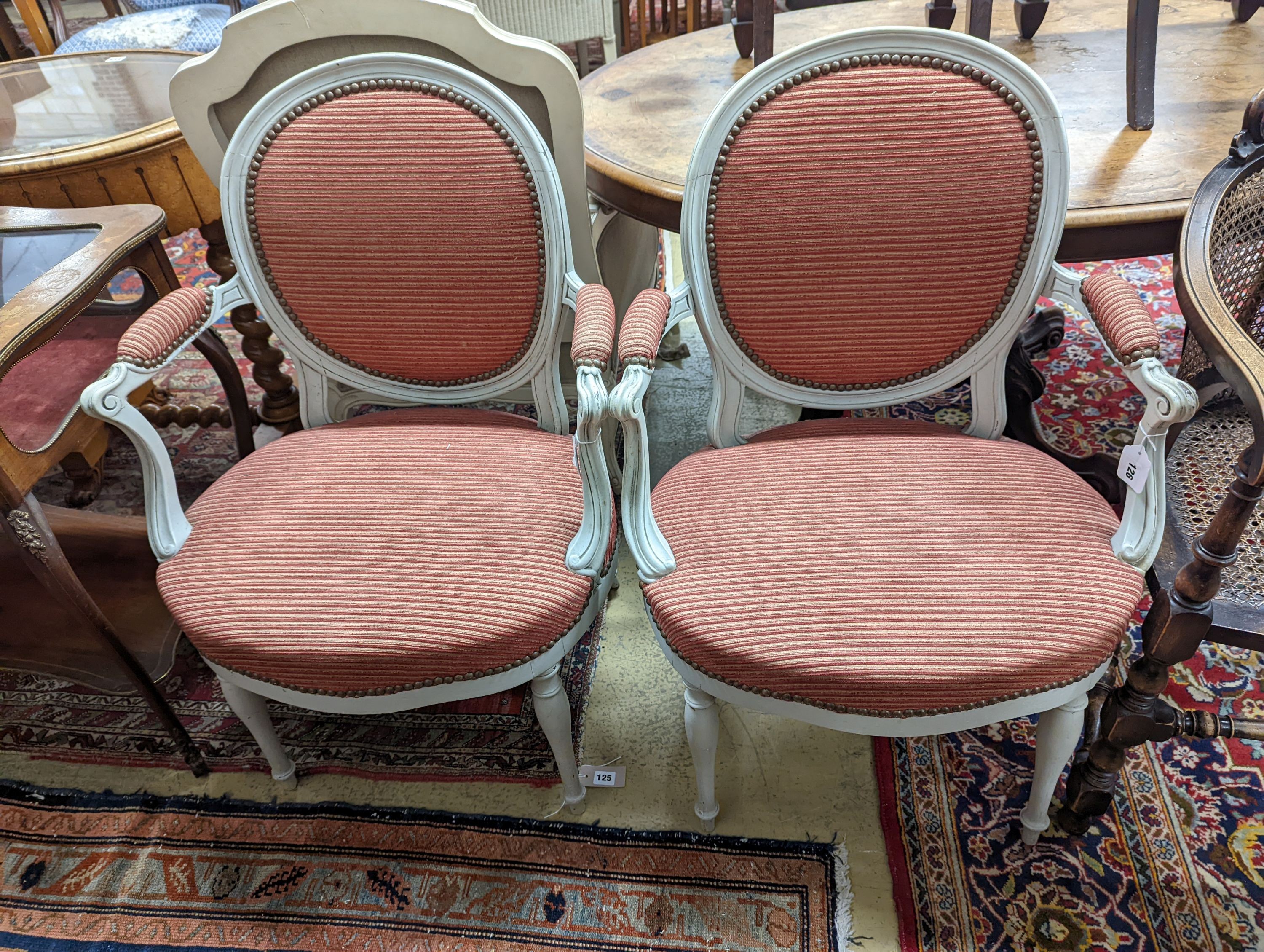 A pair of early 20th century French painted upholstered armchairs, width 59cm, depth 48cm, height 89cm